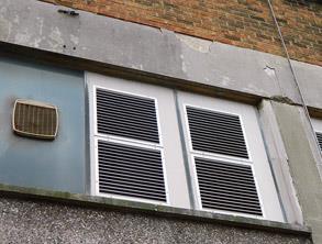 Spalled cement render at a train station